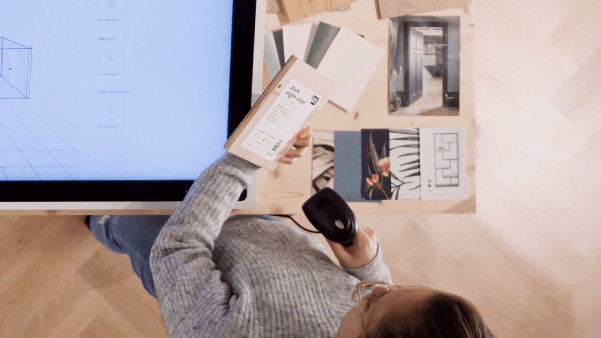 A girl scanning products on the Style Studio touchscreen